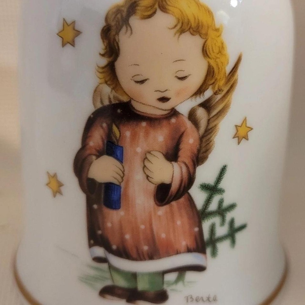 Christmas 1979 Bell with angel holding a candle, surrounded by stars and a small